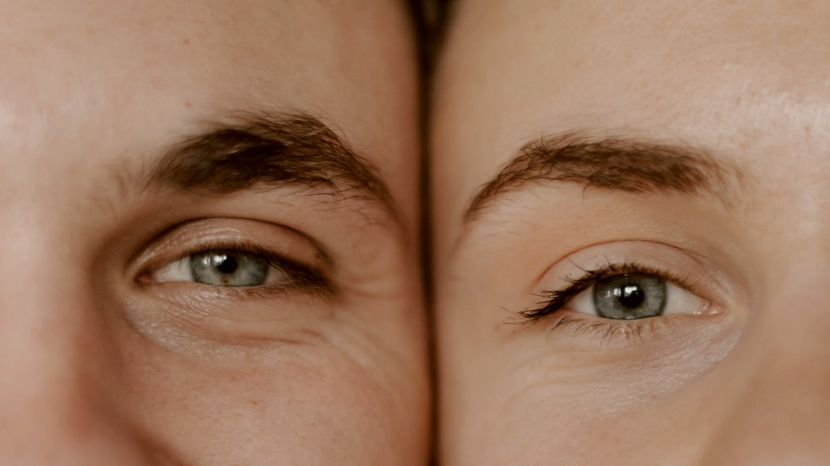 
a close up of a man and a woman with blue eyes
