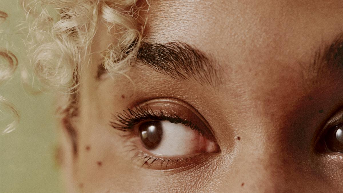 
a-close-up-of-a-person-with-curly-hair
