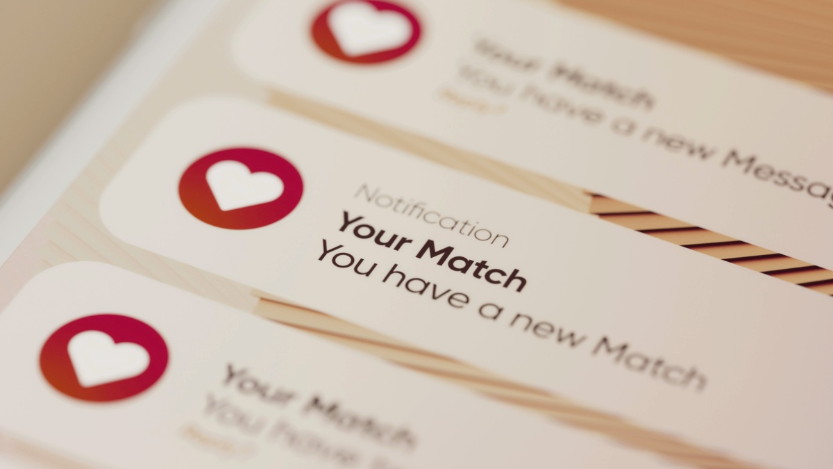 
A close up of a phone with dating app notifications by Planet Volumes
