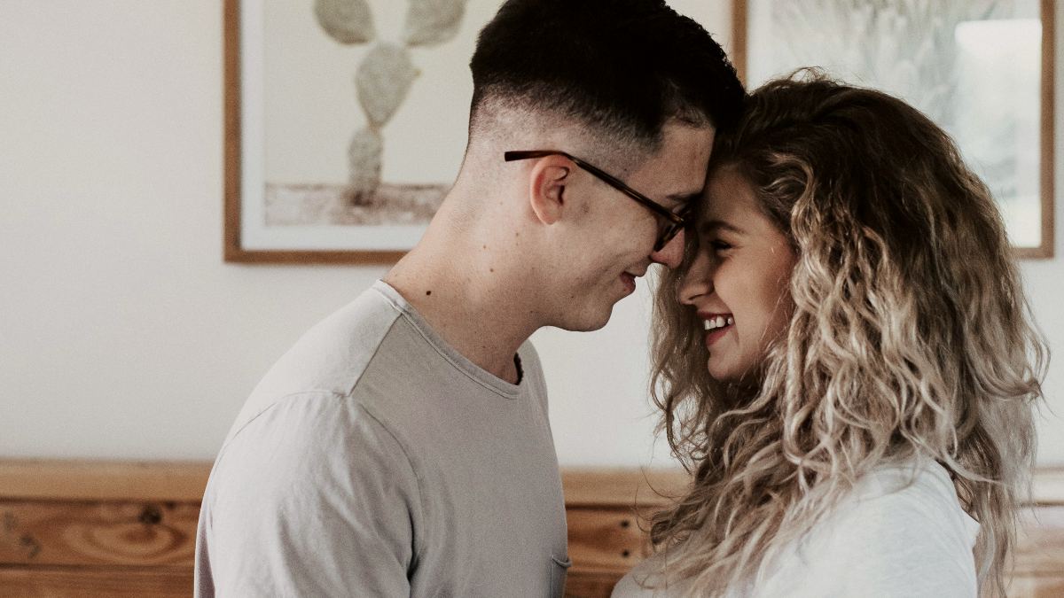 
a-couple-embracing-in-the-bedroom
