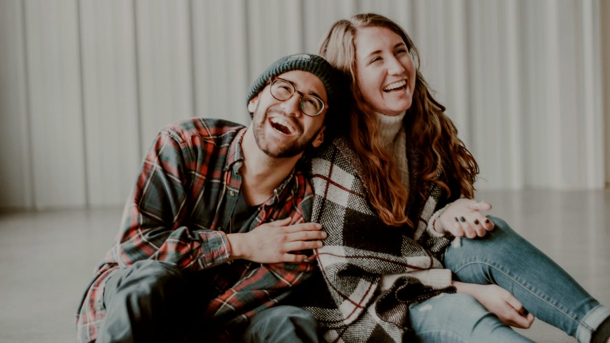 
a-couple-laughing-together-on-the-floor
