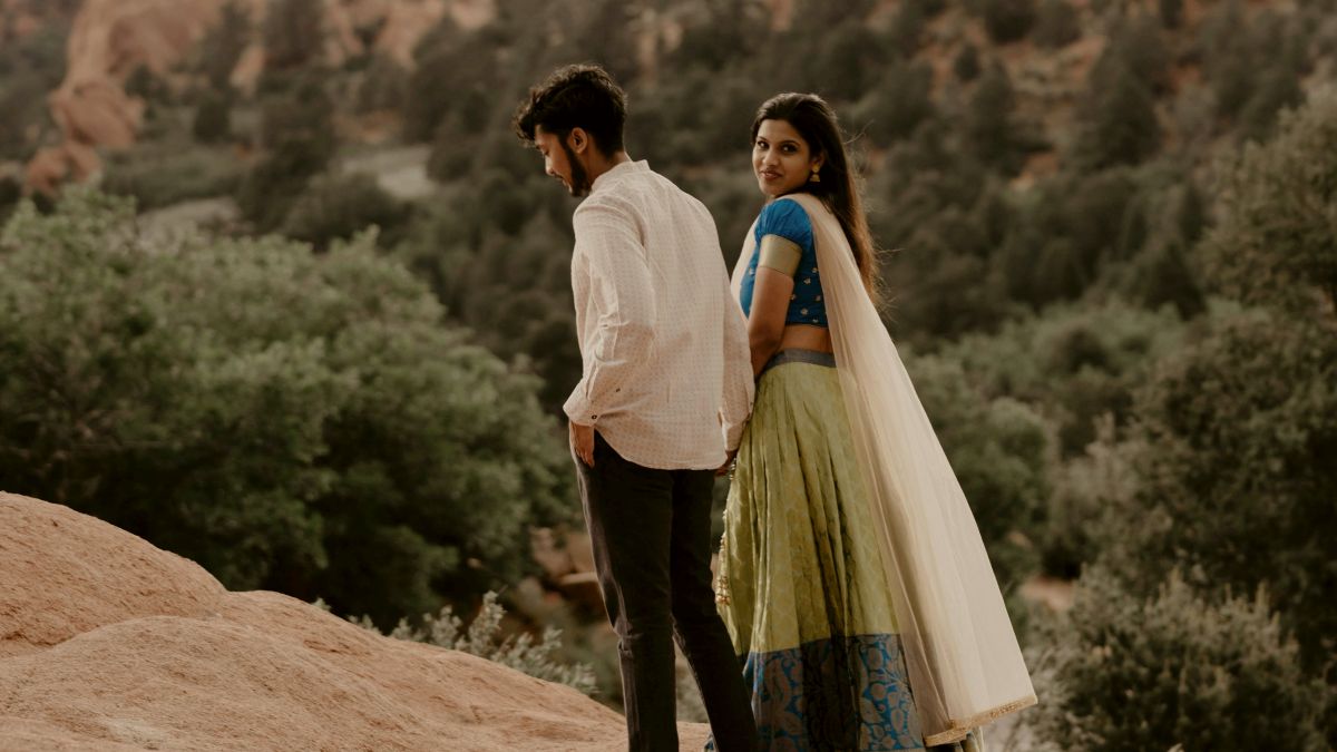 
a-couple-walking-on-a-cliffside
