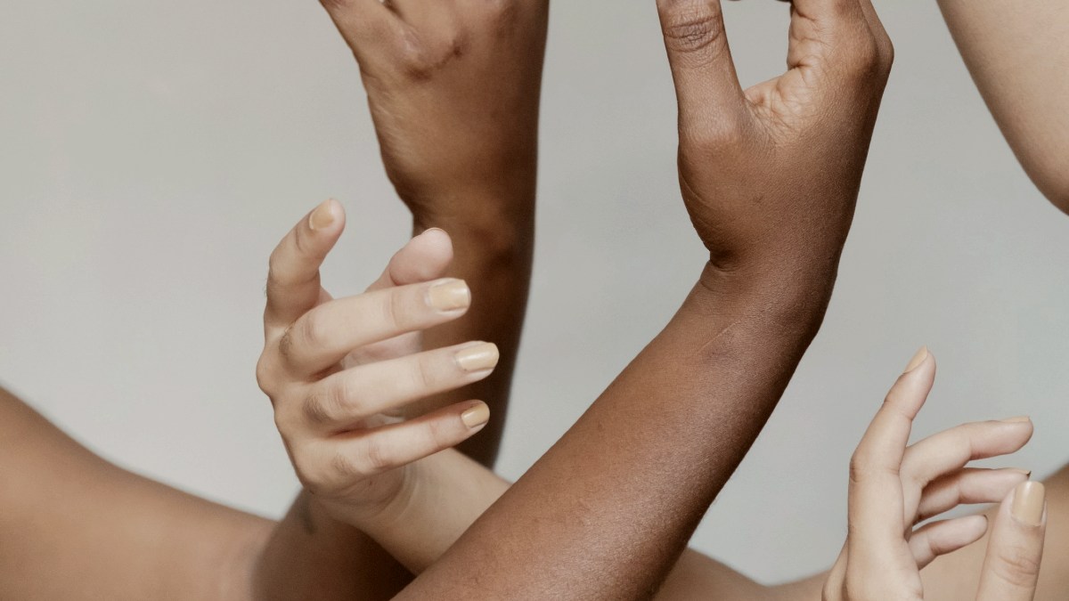 
a group of hands reaching up into the air by Thais Varela
