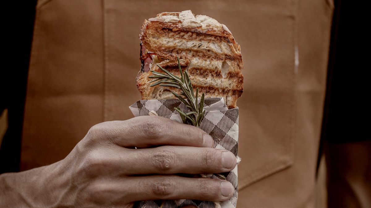 
a-hand-holding-a-toasted-sandwich
