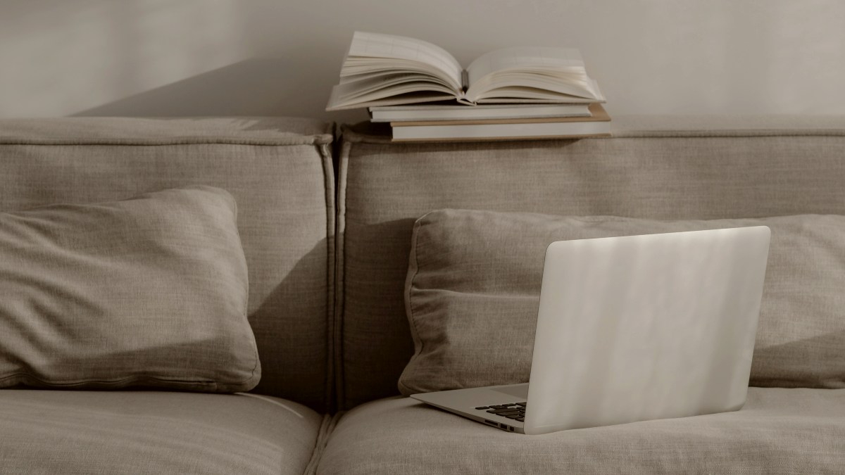 
a-laptop-computer-sitting-on-top-of-a-couch
