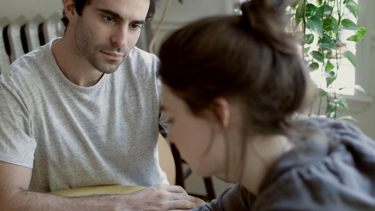 
a man and a woman sitting at a table by Gabriel Ponton
