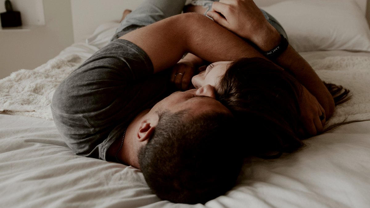 
a-man-and-woman-cuddling-together-in-bed
