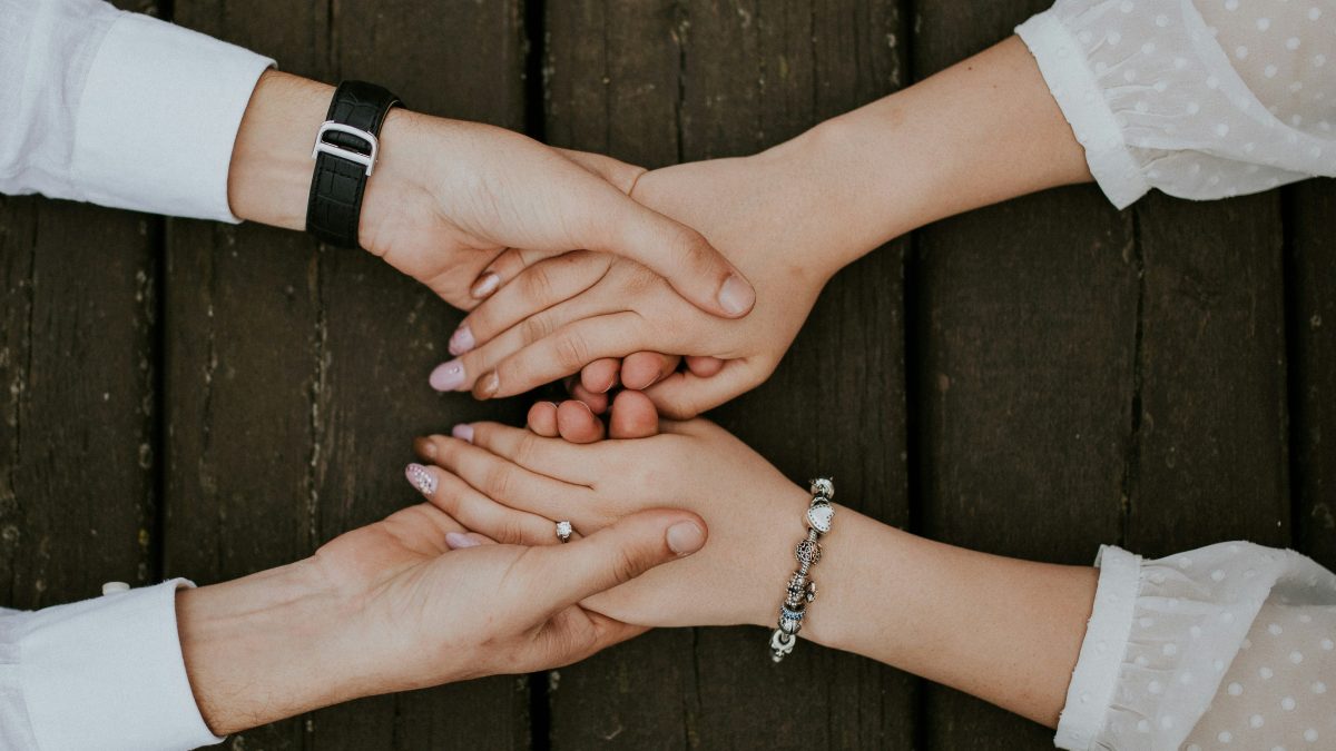 
a-man-and-woman-holding-hands
