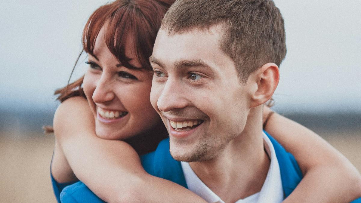 
a man and woman hugging outdoors by Mihail Tregubov
