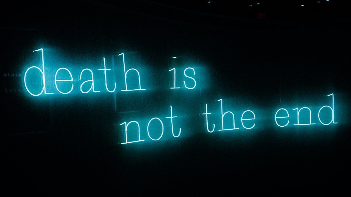 
a neon sign alluding to an afterlife that might affect your actions in your present life
