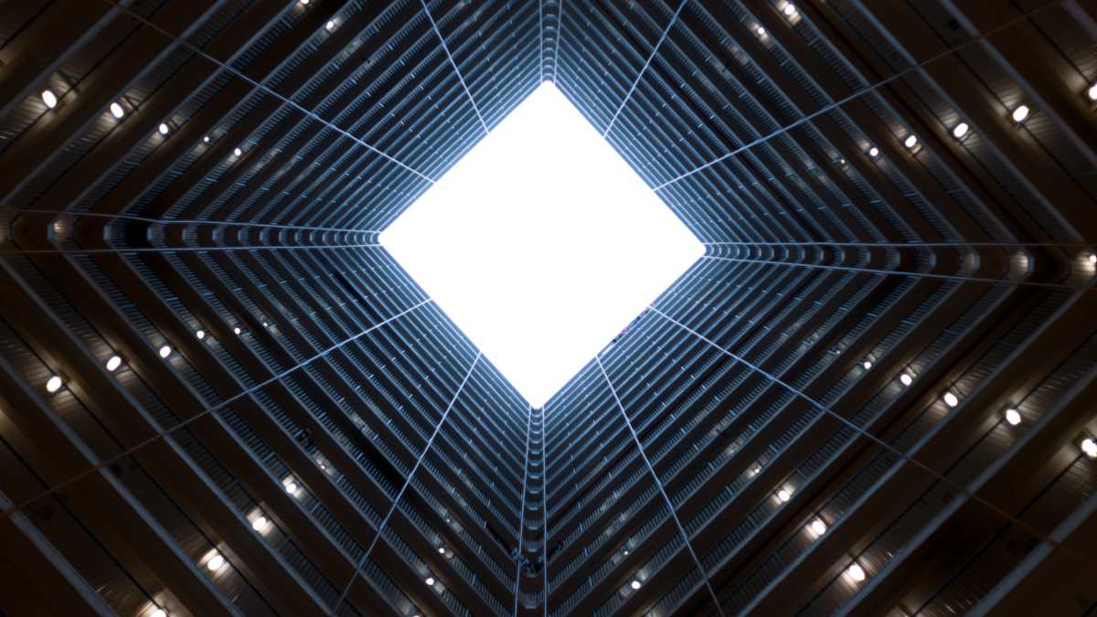 
a person looking down a long tunnel which symbolizes seeing into the future
