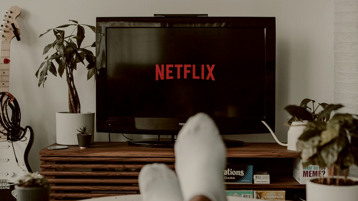 
a-person-lounging-as-they-watch-netflix
