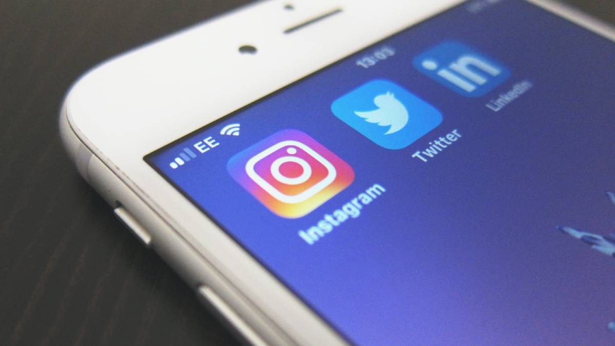 a phone with social media apps including linkedin for professionals and job seekers