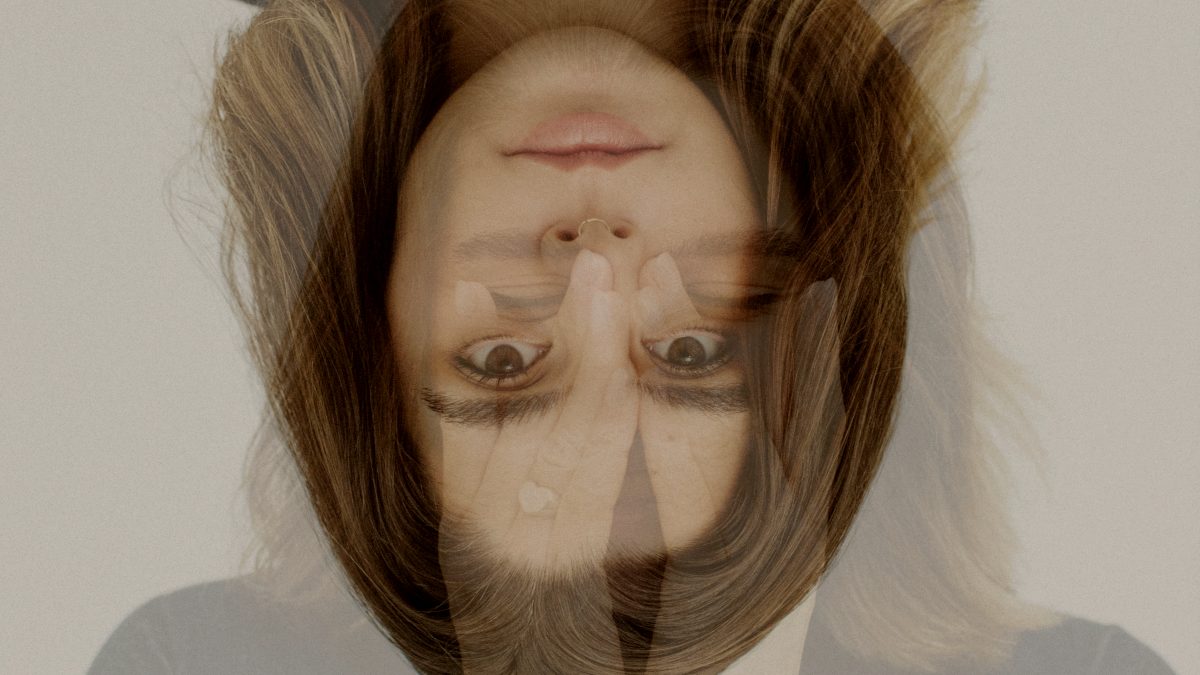 
A portrait photograph shows a woman with double exposure by frank flores

