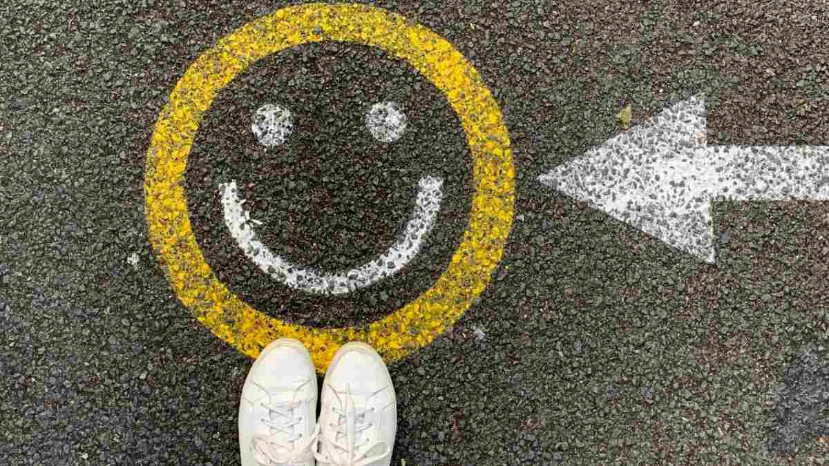 
A sign on a road indicating the right path to happiness and positivity.
