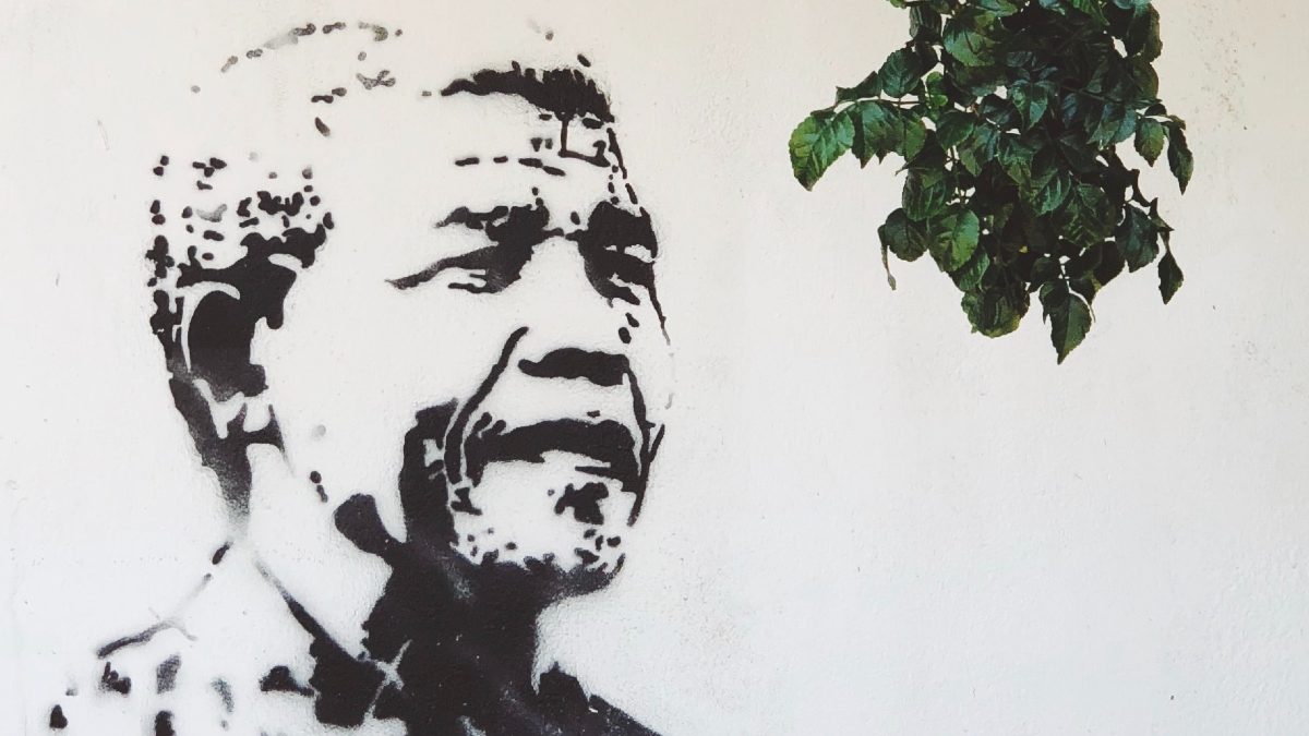 
a street art piece of Nelson Mandela who most people wrongfully thought of as having died in prison

