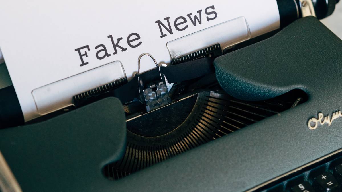 
a typewriter showing the words fake news
