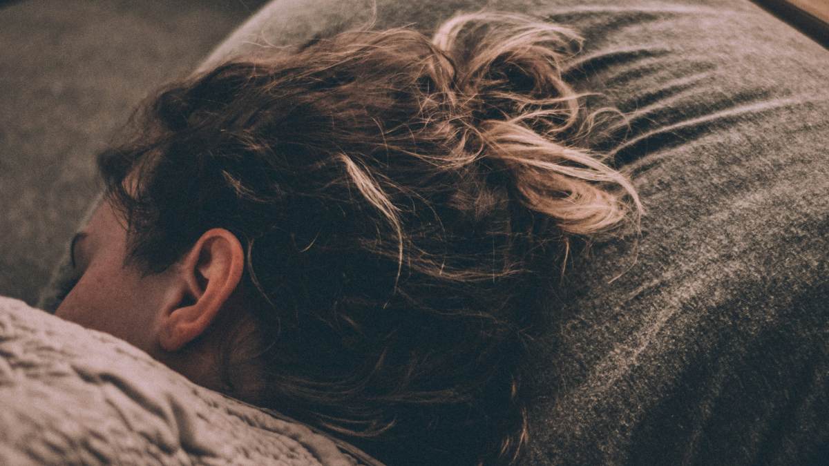 
a-woman-struggling-to-fall-asleep
