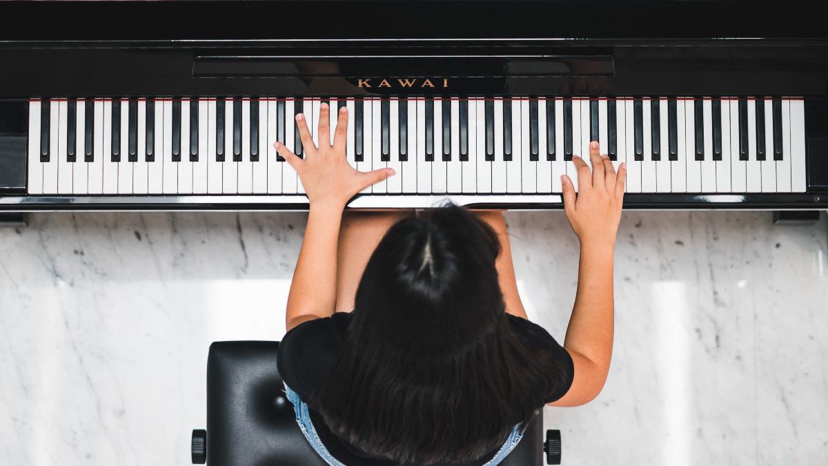 
a young person playing the piano in a state of flow and unbound creativity

