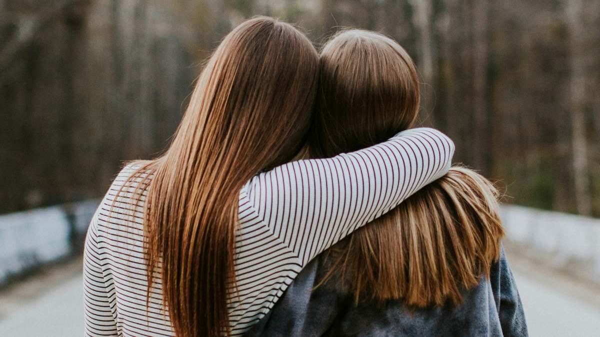 
an-emotional-influencer-hugging-her-friend
