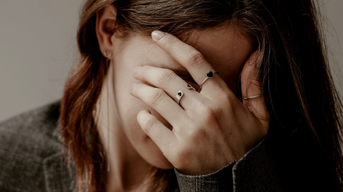 
an-overthinking-woman-covering-her-face-with-her-hands
