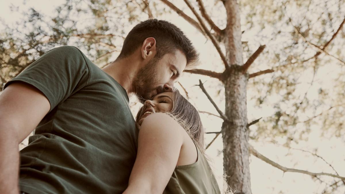 
Beautiful young couple have a good time in the forest at daytime by Getty Images
