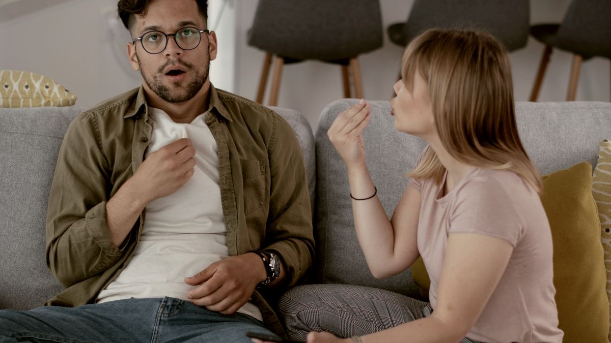 
Boyfriend and girlfriend are arguing on the couch angry woman is yelling at her boyfriend by getty images
