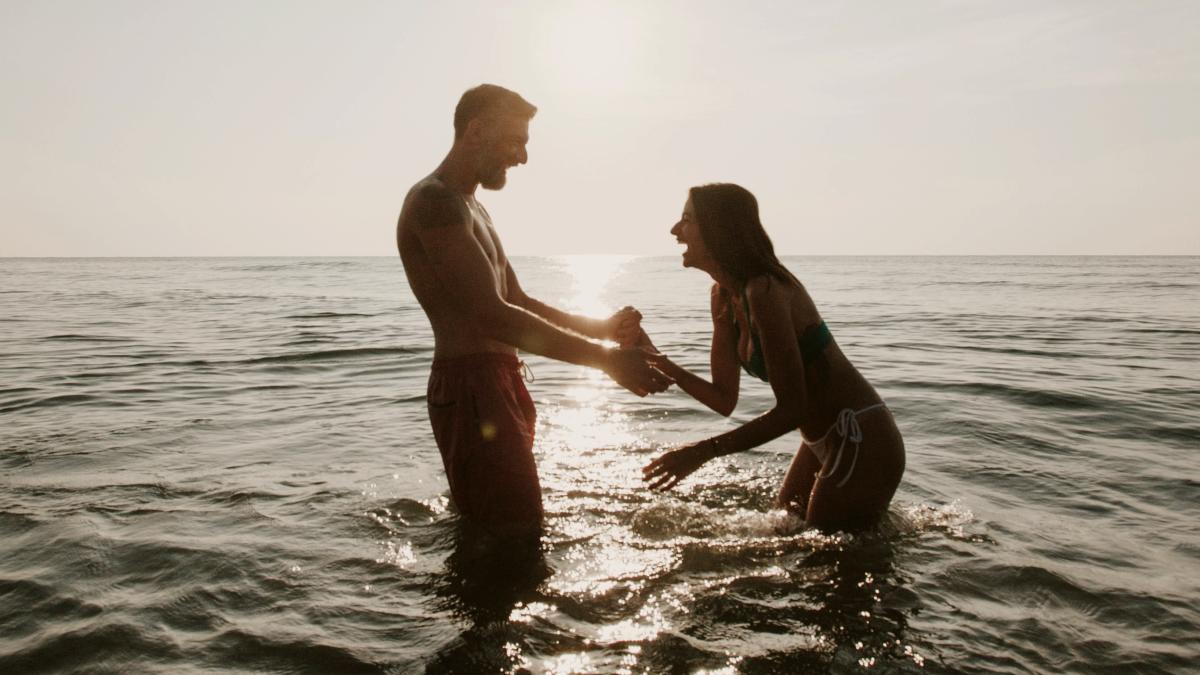 
Couple at the beach playing in the water
