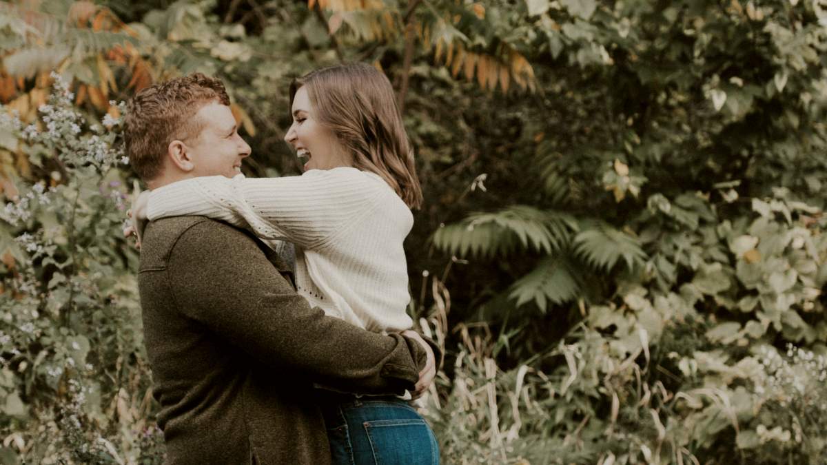 
couple beside green leafed tree during daytime
