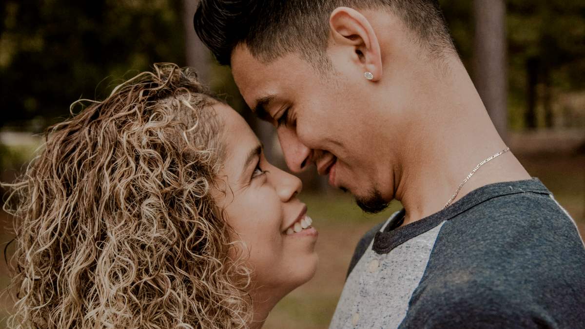 
couple standing face to face closely to each other
