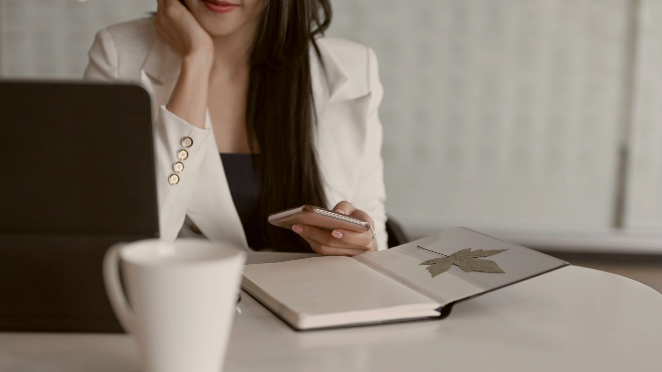 
Cropped shot of executives businesswoman using smart phone at her workplace by Getty Images
