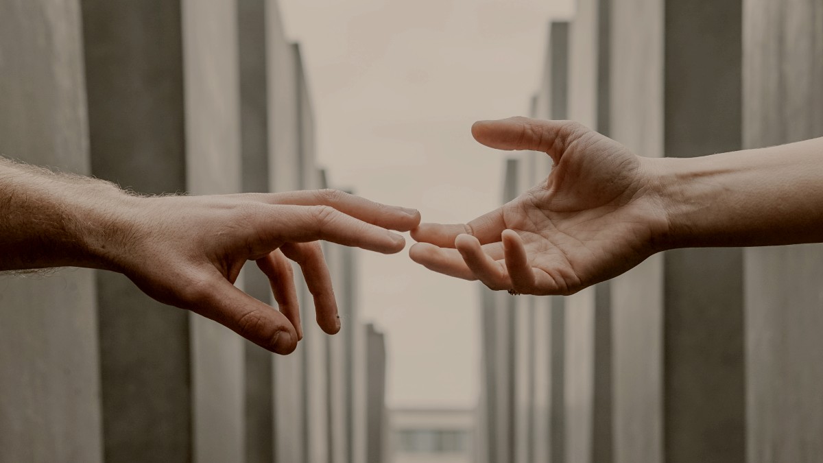 
female hand and male hand reaching for each other by toa heftiba
