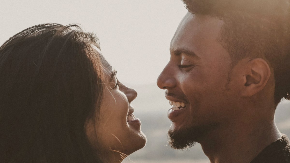 
man and woman facing each other laughing by Giorgio Trovato
