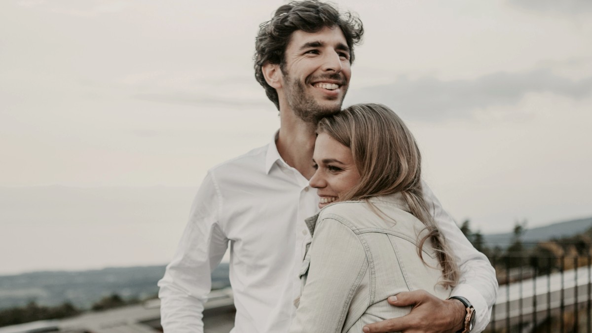 
man and woman hugging each other and smiling by Candice Picard
