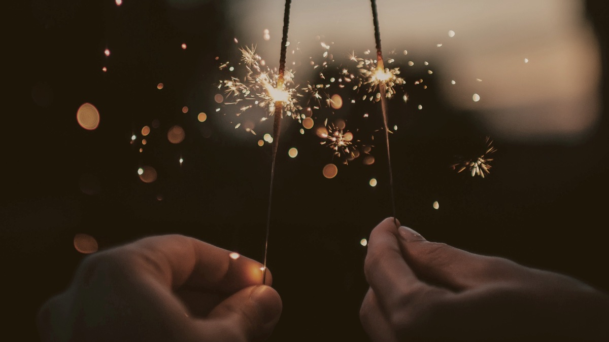 
two-hands-holding-sparklers
