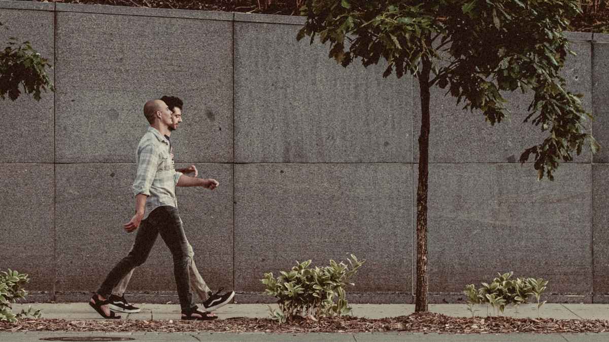 
two-strangers-walking-and-talking-together
