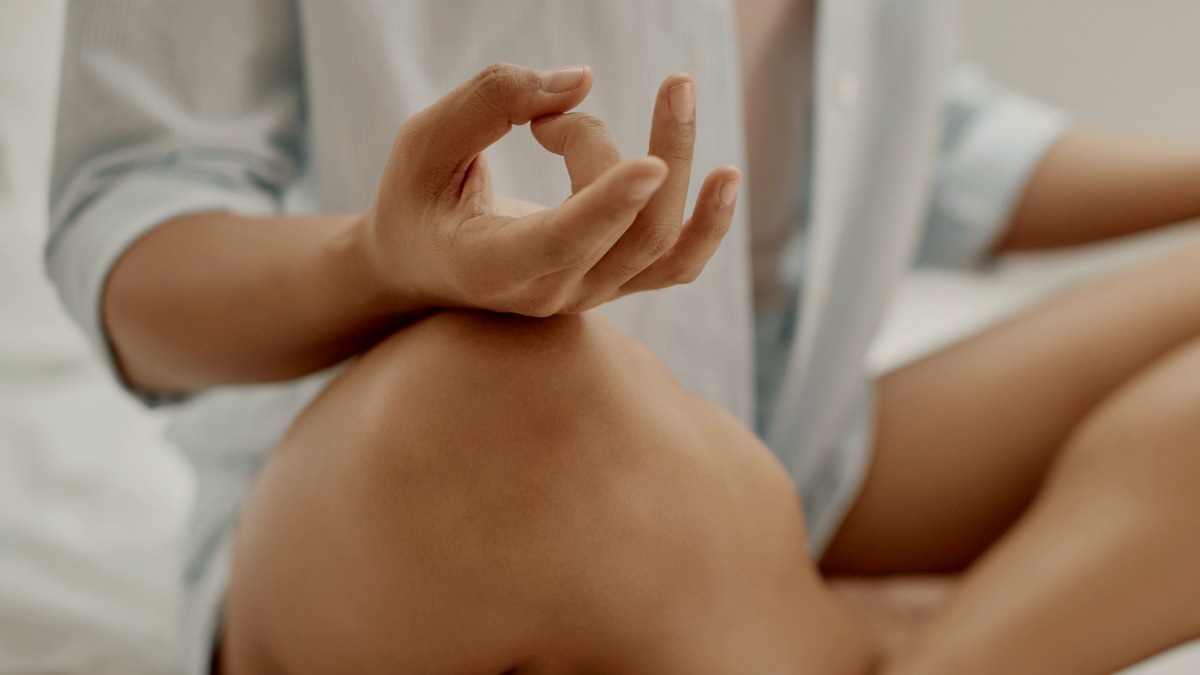 
unrecognizable-woman-practicing-yoga-on-a-bed-in-the-morning
