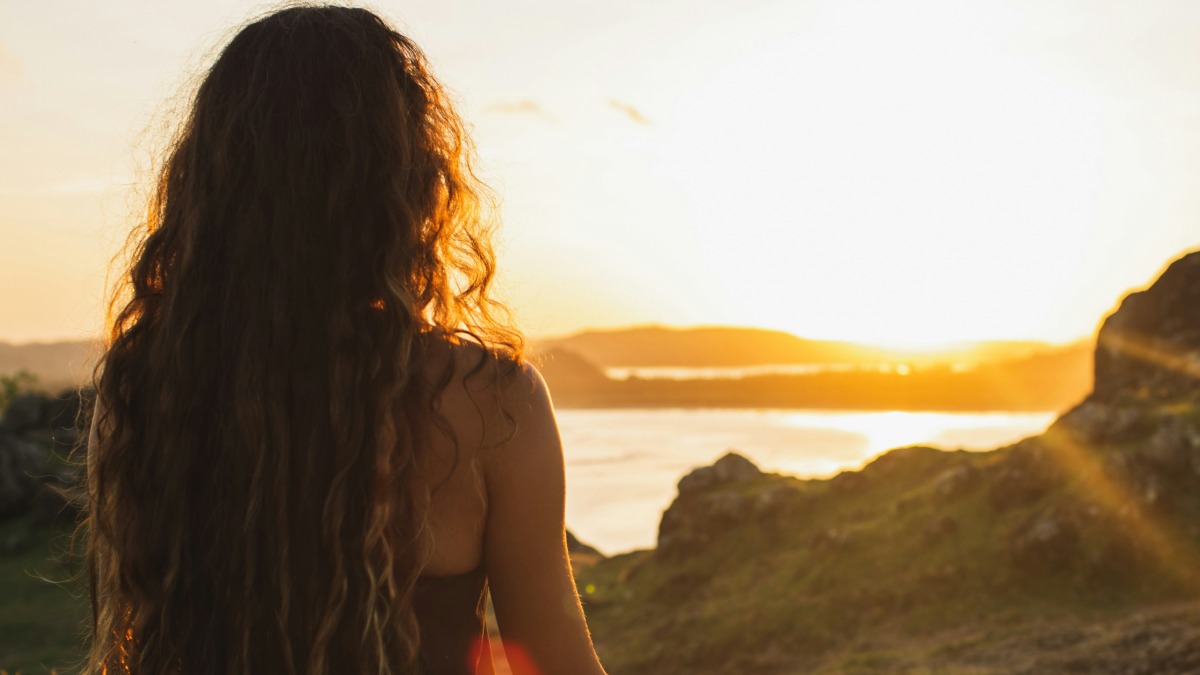 
Woman meditating yoga alone at sunrise mountains by Getty Images
